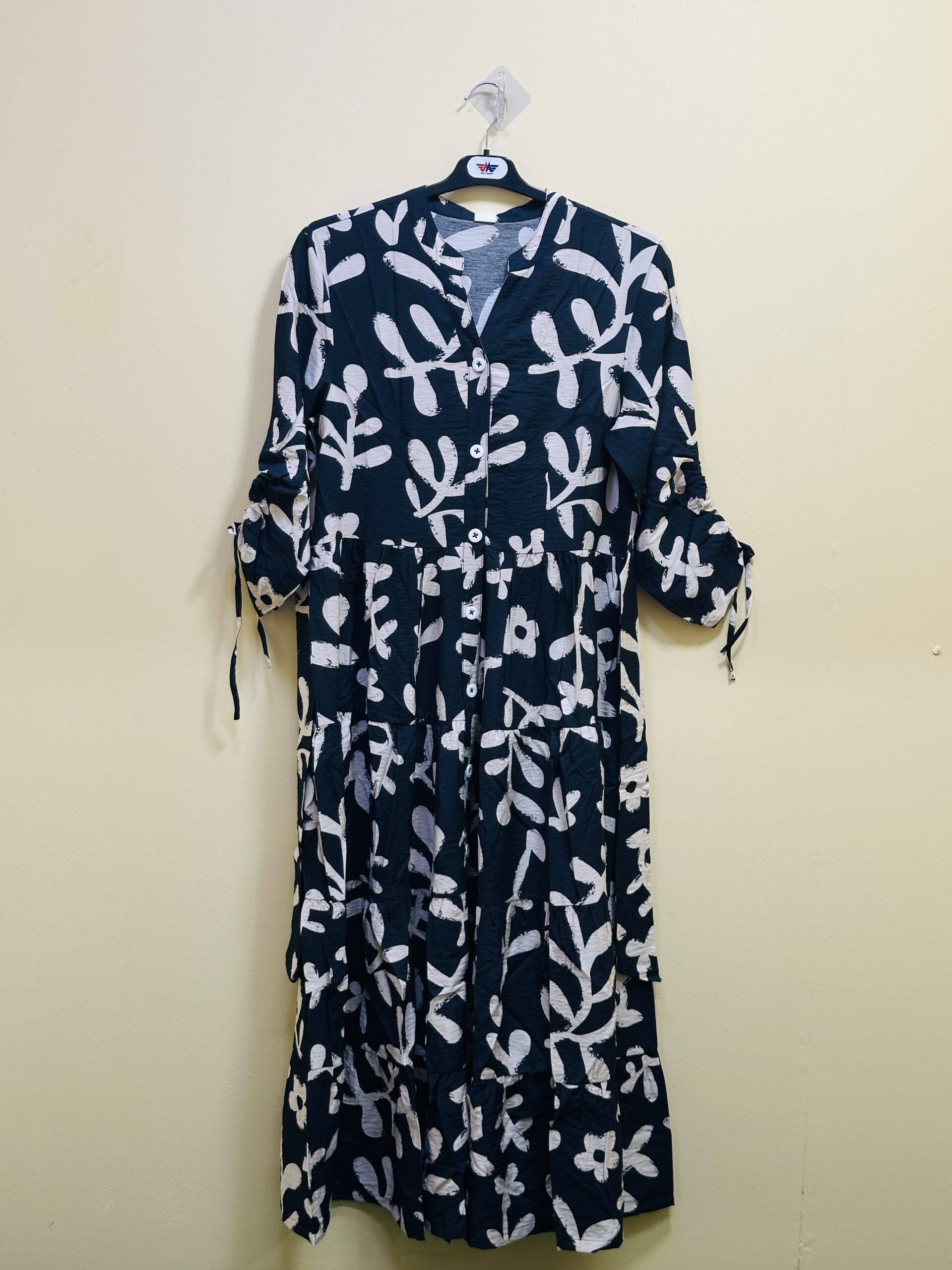 Apparel Tech Pack: 12 Essential Checks for Better Production 8 Navy midi dress with a white botanical print